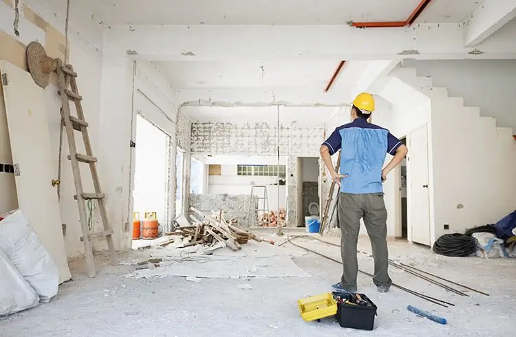 Builder assessing renovation site for Builders Central Otago's Renovations Central Otago service.