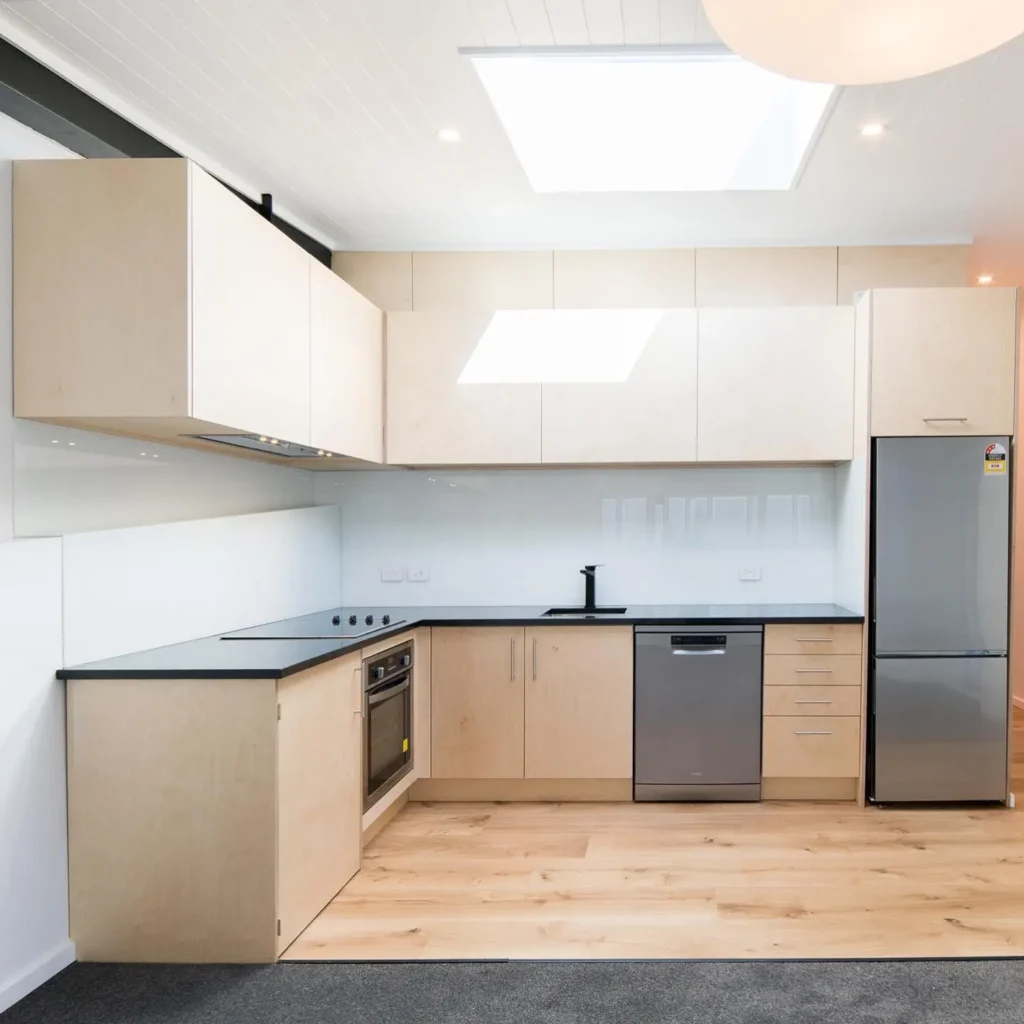 Bright, modern kitchen renovation with wooden flooring by Kitchen Renovations Central Otago.